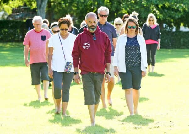 DM1987076a.jpg. Life Coach Lee Cuddis holding a mindful walking event in Horsham Park. Photo by Derek Martin Photography. SUS-190109-113118008