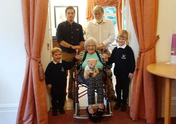 Clare Wills at her 100th birthday party with son Terry, grandson Christopher and great-gradsons Jasper and Stewie SUS-191009-131818001