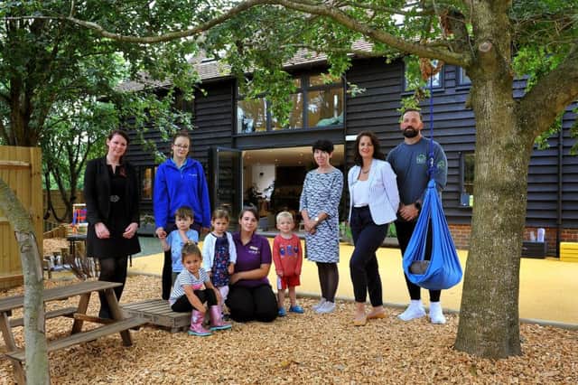 Nursery owner Hayley Peacock, right,, at the newly-opened  premises with Michael Smith of TMC Construction, 
and architect Helen Gaffney with staff and children. Photo: Stvee Robards SR1922091 SUS-190309-102501001