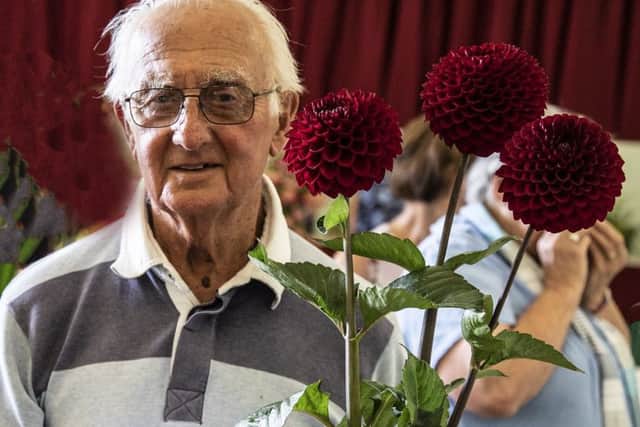 Ted Banks with his dahlias, which scooped all the top prizes