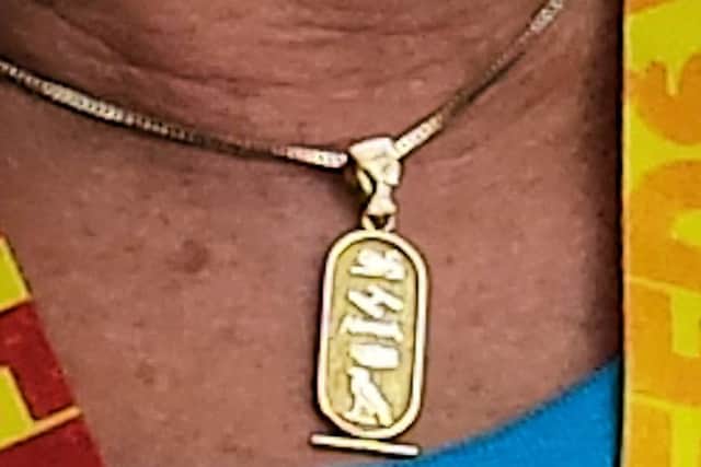 The distinctive gold pendant, stolen in Cowfold. Photo contributed by Sussex Police