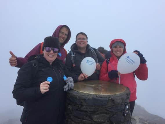 Kerry and husband Ben on top of Snowdon with friends