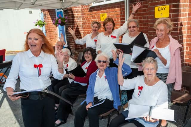 Members of the Age UK Choir entertain visitors at the We Will Meet Again event