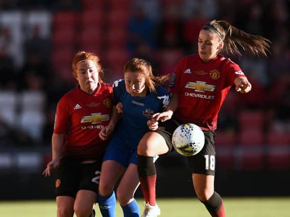 Martha Harris and Kirsty Hanson of Manchester United Women challenge Danielle Lane of Lewes women during the Women's Super League on May 11, 2019. (Photo by Nathan Stirk/Getty Images)