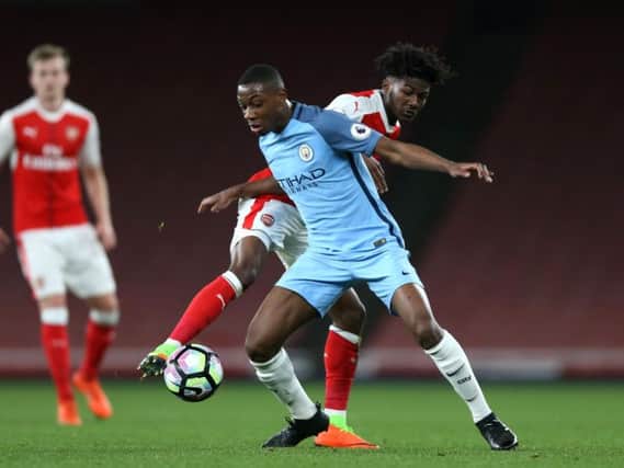 Denzeil Boadu, in action for Manchester City, holds off Ainsley Maitland-Niles during the Premier League 2 against Arsenal and Manchester City. (Photo by Alex Pantling/Getty Images)