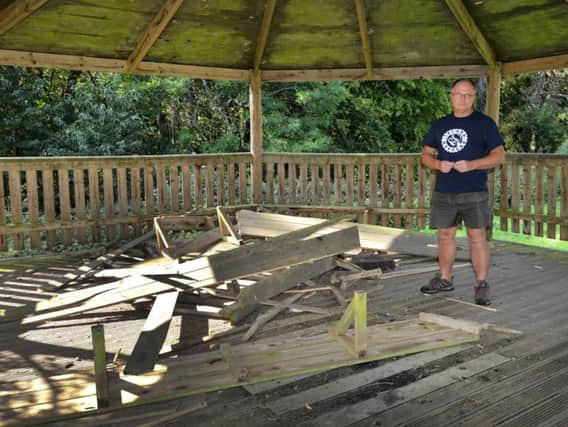 Ed Croft, the schools business manager, pictured alongside the damage
