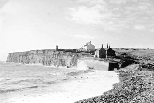 The coastguard cottages have become a tourist attraction on the cliffs SUS-190609-154822001