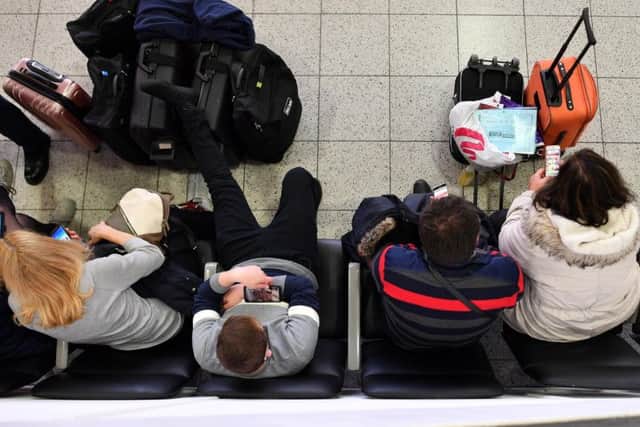 Travellers queue at Gatwick Airport earlier this year. Pic: BEN STANSALL/AFP/Getty Images