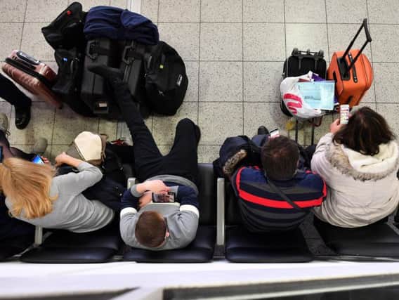 Travellers queue at Gatwick Airport earlier this year. Pic: BEN STANSALL/AFP/Getty Images