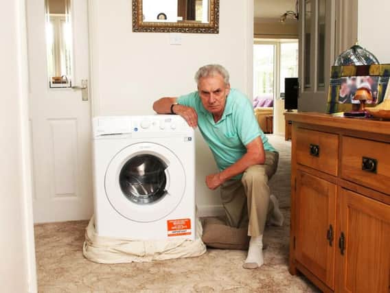 Paul Darnes from Rustington with the faulty washing machine. Picture: Derek Martin