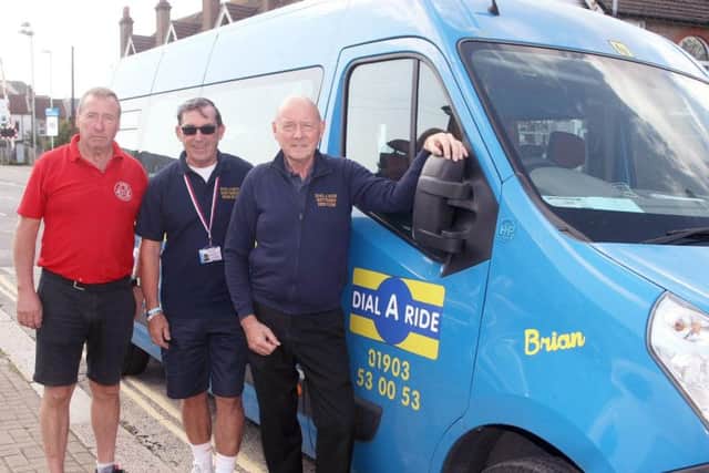Dial-a-Ride bus renamed in honour of Brian Ingham, driver who died of a stroke. From left, Mark Hooper (from A-Z signs), driver Stuart Cooper and Gary Mills, manager. Photo by Derek Martin Photography.