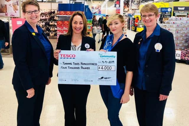Turning Tides received a cheque from Tesco for £4,000, raised through its Bag for Life green tokens scheme.