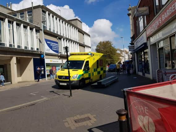 The ambulance moved the patient from where they fell in South Street, Worthing. Picture: Jasmin Martin