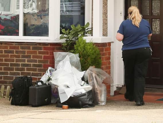 The National Crime Agency officer at a property in Westdean Road, Worthing