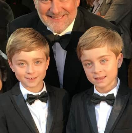Downton Abbey movie premiere. Zac and Oliver Barker from Ashington with Hugh Bonneville