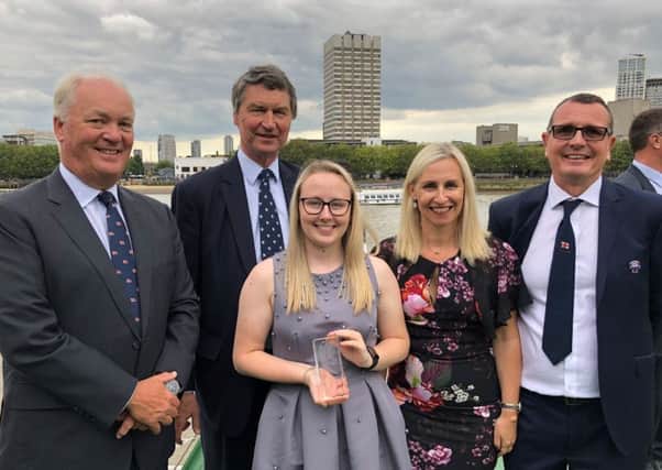Isobel Tugwell with Mark Dowie , RNLI Chief Executive, and her parents Michelle and Simon Tugwell