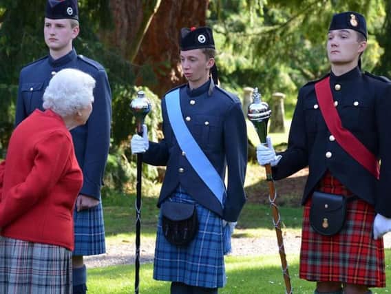 Flight Sgt James Aird, Drum Major, (wearing blue sash) spoke to Her Majesty The Queen at Balmoral