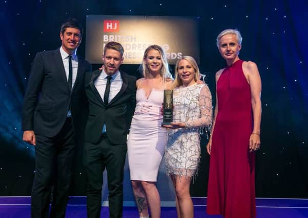 The team received the award from Vernon Kay. Photo courtesy of HJs British Hairdressing Business Awards 2019
