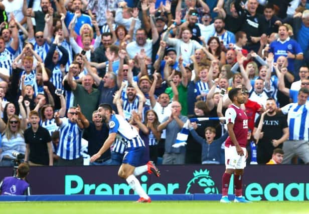BRIGHTON, ENGLAND - SEPTEMBER 14: Neal Maupay of Brighton and Hove Albion celebrates after scoring his team's first goal during the Premier League match between Brighton & Hove Albion and Burnley FC at American Express Community Stadium on September 14, 2019 in Brighton, United Kingdom. (Photo by Dan Istitene/Getty Images) SUS-190914-181725002