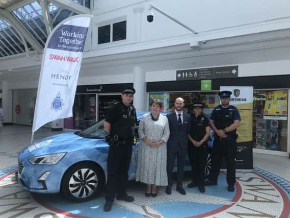 Gill and local policing team at the presentation of the sponsored police car earlier this year