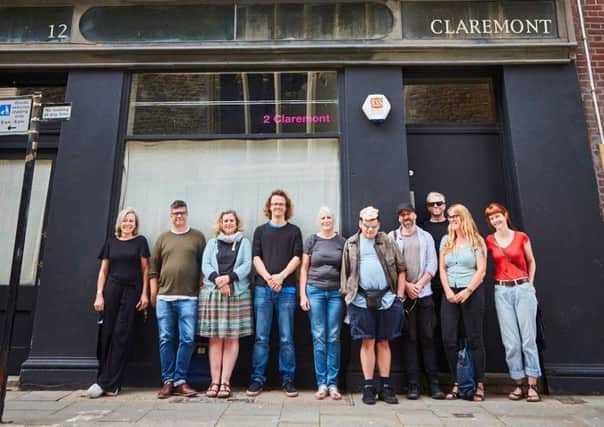 Teams from Heart of Hastings CLT and Project Artworks, standing outside 12 Claremont, Hastings, their latest project gifted to them as a community asset transfer from East Sussex County Council. Picture: Jonny Thompson