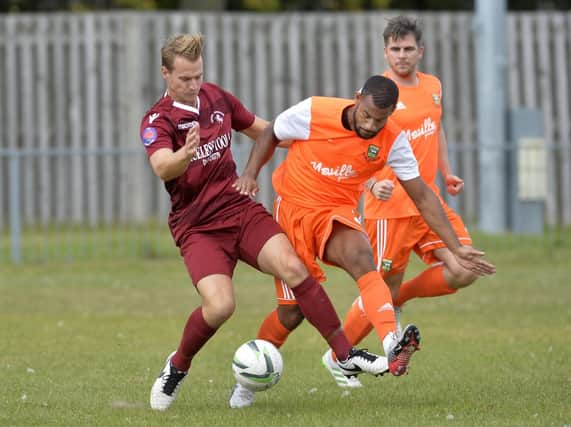 Action from Little Common's FA Cup clash with Hendon. Picture by Jon Rigby