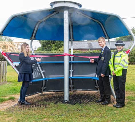 Students Hugo and Evie cut the ribbon with PCSO Julie Pearce-Martin