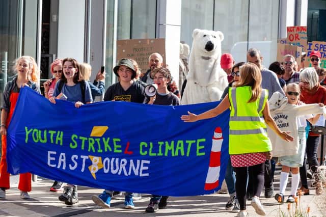 Tilia Guilbaud-Walter, far left, and protesters in Eastbourne as part of the Global Climate Strike  Credit: SEUK News/Alamy Live News. (Photo by Pete Abel)