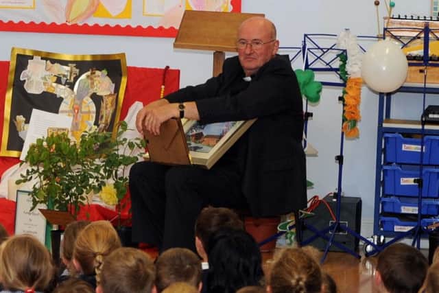 Father David celebrating his golden jubilee at St Wilfrid's Catholic Primary School in Angmering in 2011. Picture: Malcolm McCluskey L24187H11