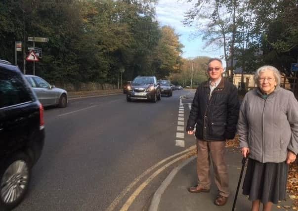 Cllr Martin Clarke with a resident calling for a crossing at The Ridge.
