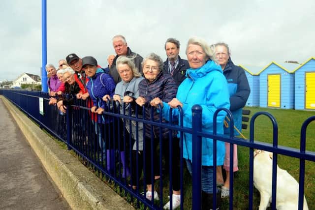 Residents and councillors calling for railings at the Felpham beach huts to be removed