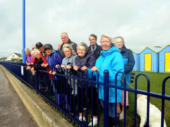 Residents and councillors calling for railings at the Felpham beach huts to be removed