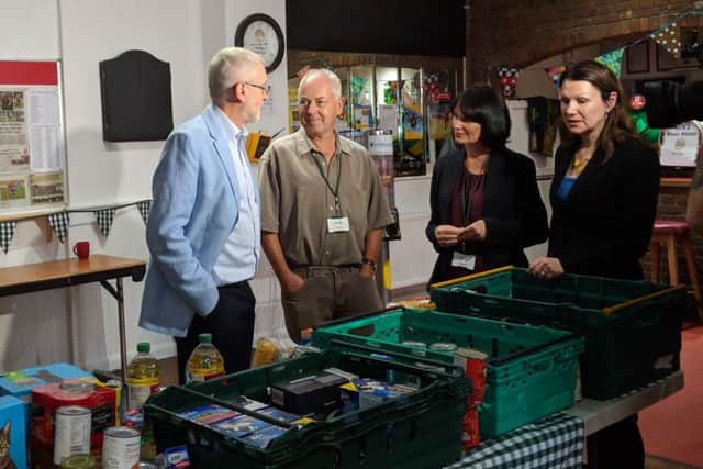 Jeremy Corbyn, foodbank volunteer Paul Redfern, and Whitehawk Foodbank communications manager Anne Amner, and shadow environment secretary Sue Hayman,