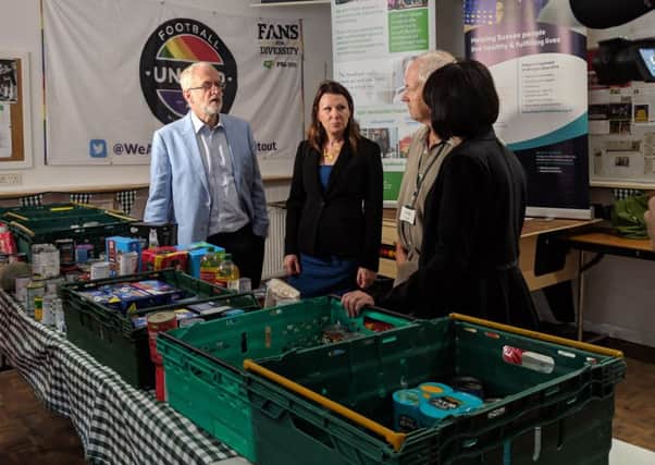 Jeremy Corbyn, shadow environment secretary Sue Hayman, foodbank volunteer Paul Redfern, and Whitehawk Foodbank communications manager Anne Amner