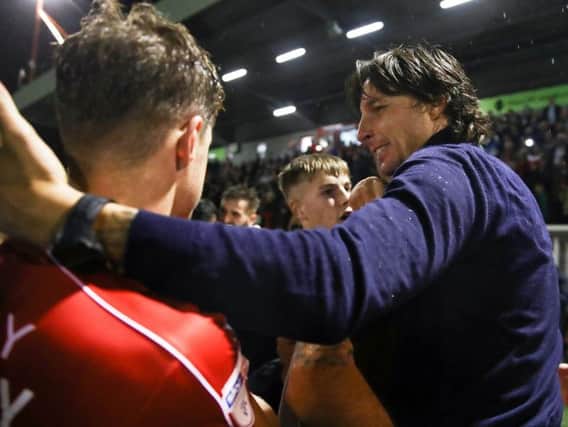 Crawley Town head coach Gabriele Cioffi celebrates with Josh Doherty after winning the penalty shoot out against Stoke City. Picture courtesy of Getty Images