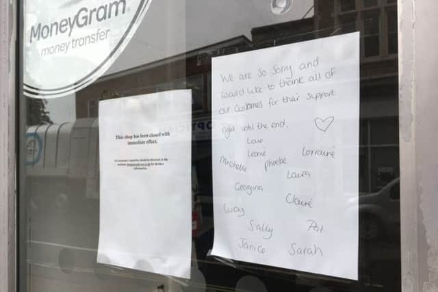 The note in the window of Thomas Cook in Worthing town centre