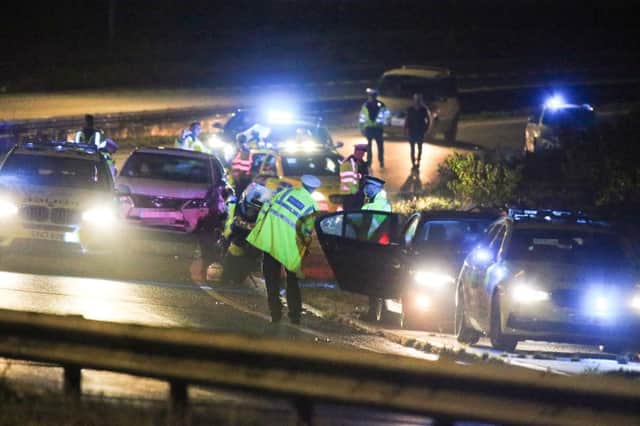 A police officer was seriously injured when he was hit by a passing car on the A27