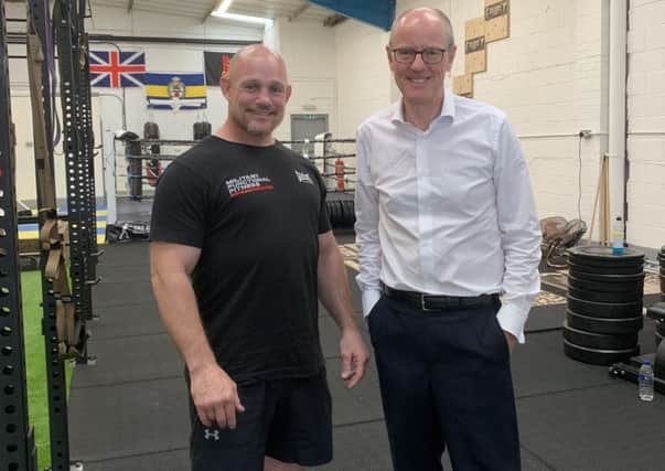 A military functional fitness gym, owned by retired Colour Sergeant Daz Dugan, has been paid a visit by MP Nick Gibb. SUS-190930-132216001