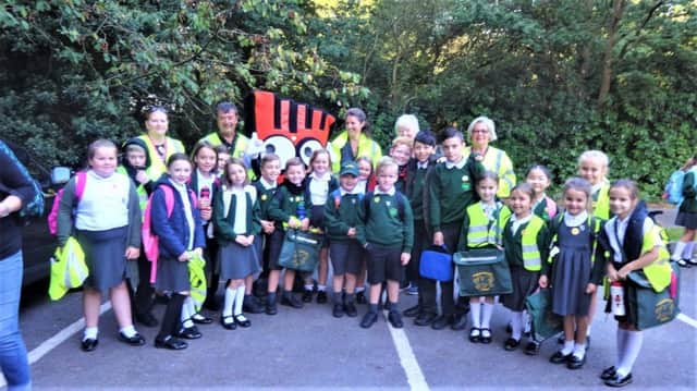 Children at Colgate Primary School are taking part in a new 'park and stride' walk-to-school scheme SUS-190926-145830001