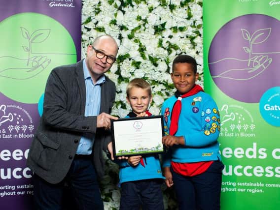 Presenter Joe Talbot hands over the award to members of the 7th Crawley Beavers
