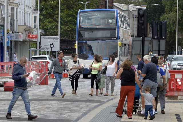 Buses and pedestrians in Terminus Road, Eastbourne (Photo by Jon Rigby)
