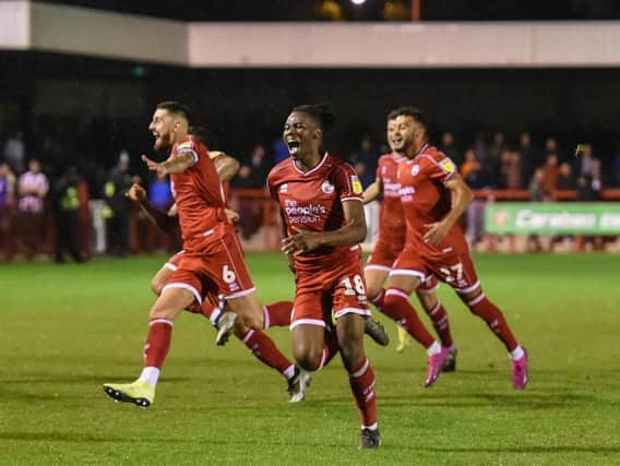Crawley Town players celebrate against Stoke City