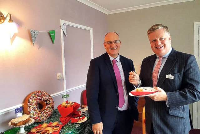Jeremy Field with principal funeral director, Howard Coote, at Fuller and Scott's coffee morning on Friday. (Ron Hill)