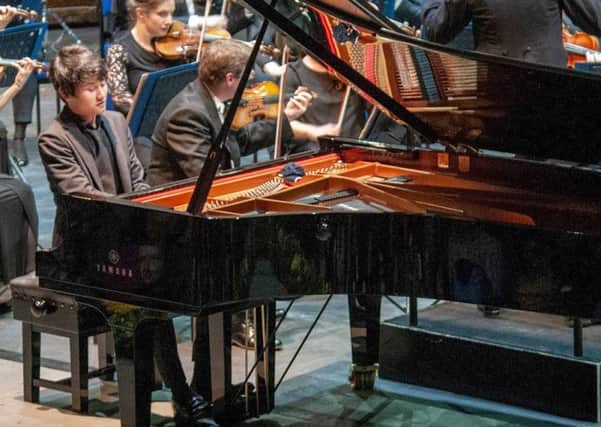 Fumiya Koido playing with the Royal Philharmonic Orchestra at the Hastings International Piano Concerto Competition