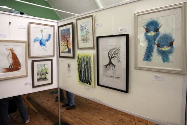 Lots of mixed media artwork featuring wildlife and exotic animals were exhibited by the group