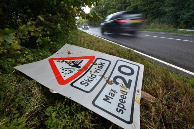 Dev Jaffe from Lewes was shocked to find dozens of discarded cats eyes and road signs dumped on the verges of the A26 near Ringmer