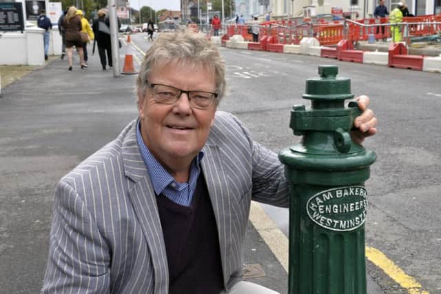 Richard Crook with the refurbished water hydrant in Gidredge Road, Eastbourne (Photo by Jon Rigby) SUS-190926-092304008
