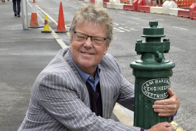 Richard Crook with the refurbished water hydrant in Gidredge Road, Eastbourne (Photo by Jon Rigby) SUS-190926-092144008
