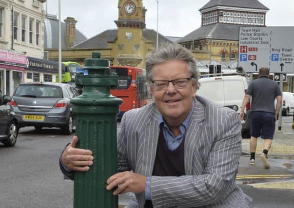 Richard Crook with the refurbished water hydrant in Gidredge Road, Eastbourne (Photo by Jon Rigby) SUS-190926-092218008