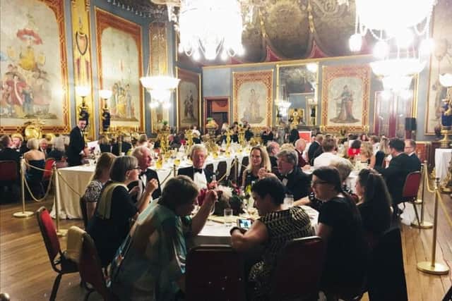 Guests enjoying the lavish dinner in the Royal Pavilion banqueting room